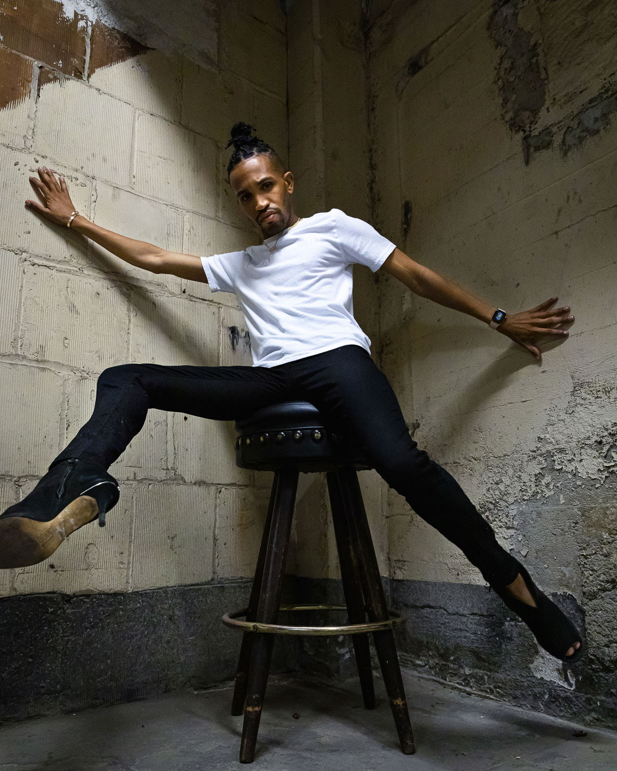 Model posing in White Heart On logo t-shirt